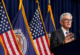 Markets dip as Fed holds rates over inflation fears.